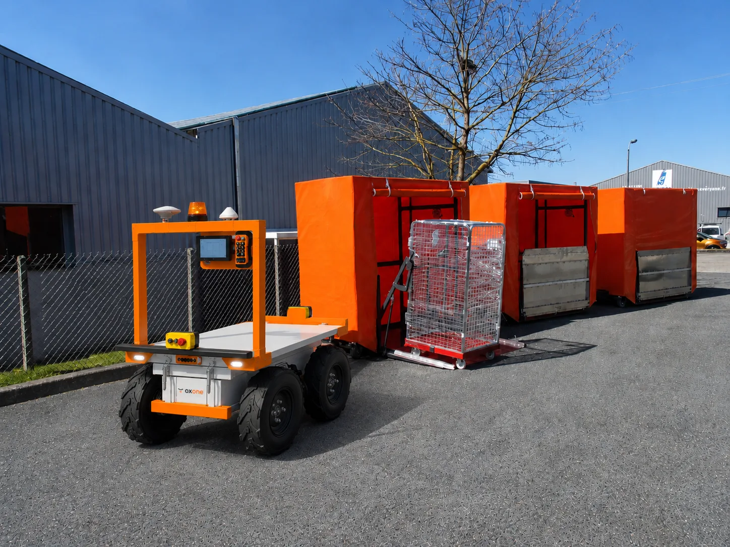 oxone pulling a train of carts through a warehouse
